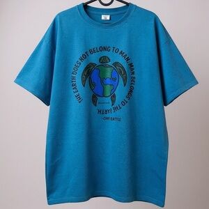 The Earth Does Not Belong to Man" Environmental T-Shirt - Teal Turtle Print